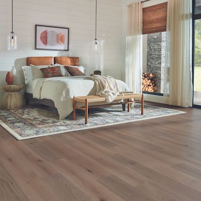 wood look laminate flooring in a cozy bedroom